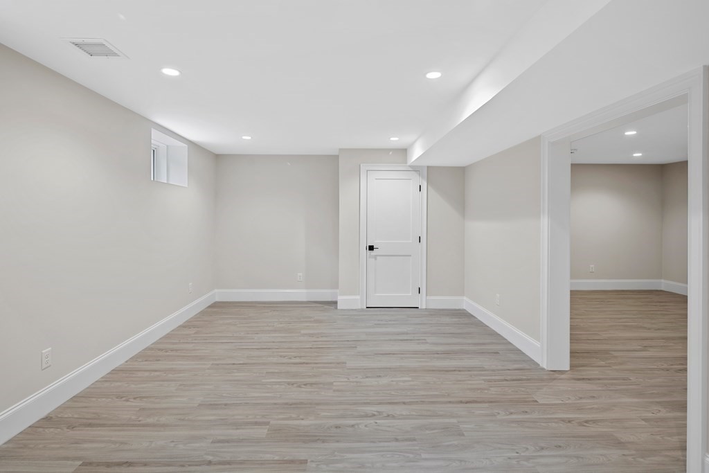 28 Hillside Avenue Needham, MA 02494 - Photo 32 of 32 a view of an empty room with wooden floor