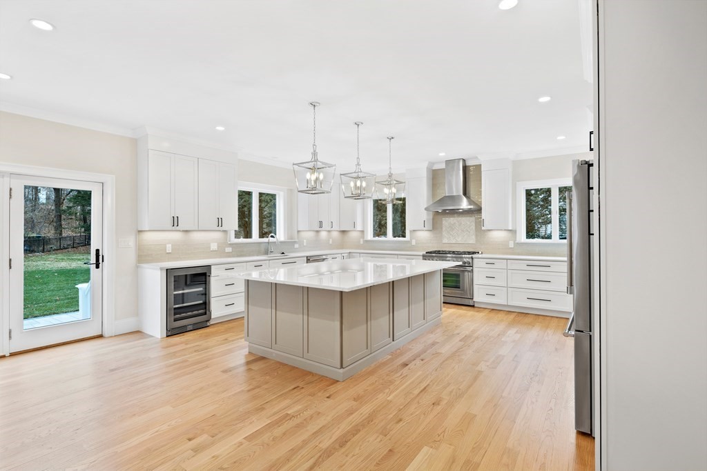 28 Hillside Avenue Needham, MA 02494 - Photo 6 of 32 a large kitchen with a large counter top appliances and cabinets