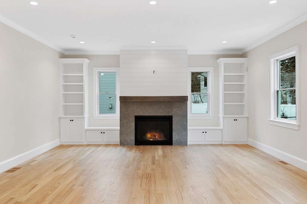 28 Hillside Avenue Needham, MA 02494 - Photo 10 of 32 a living room with furniture and a fireplace