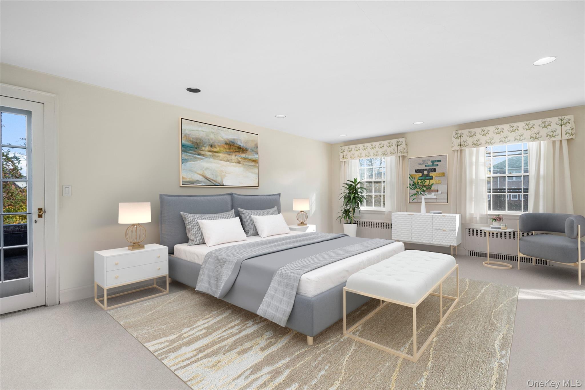 290 Overlook Road New Rochelle, NY 10804 - Photo 14 of 38 a spacious bedroom with a large bed couch and a large window