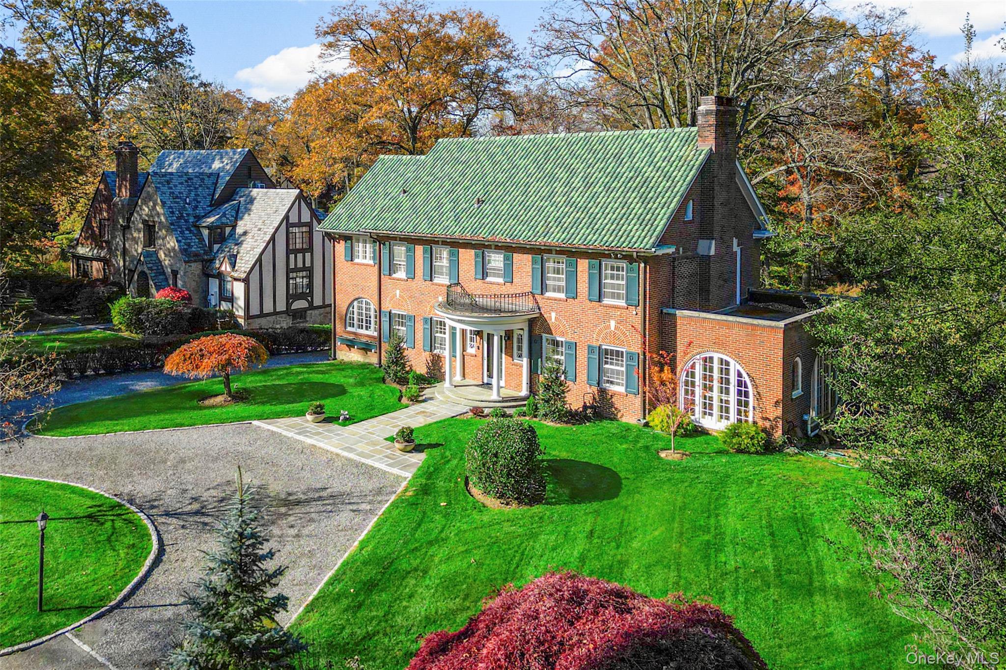 290 Overlook Road New Rochelle, NY 10804 - Photo 32 of 38 a view of a big house with a big yard and large trees