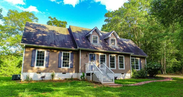 front view of a house with a yard