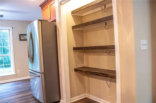 a view of front door with wooden floor