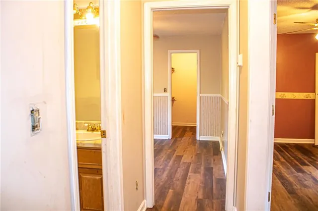 a view of a bathroom from a hallway