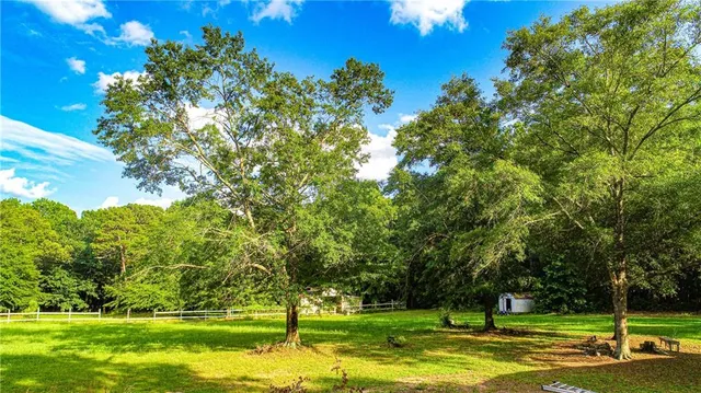 a view of a swimming pool with a yard