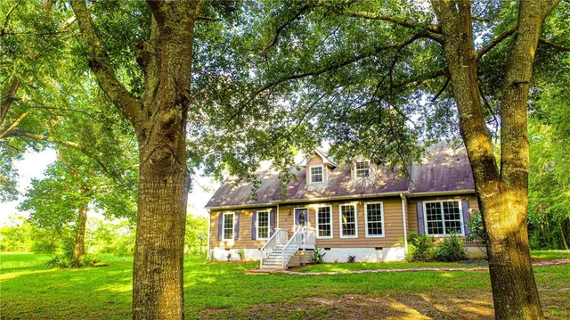 front view of a house with a yard