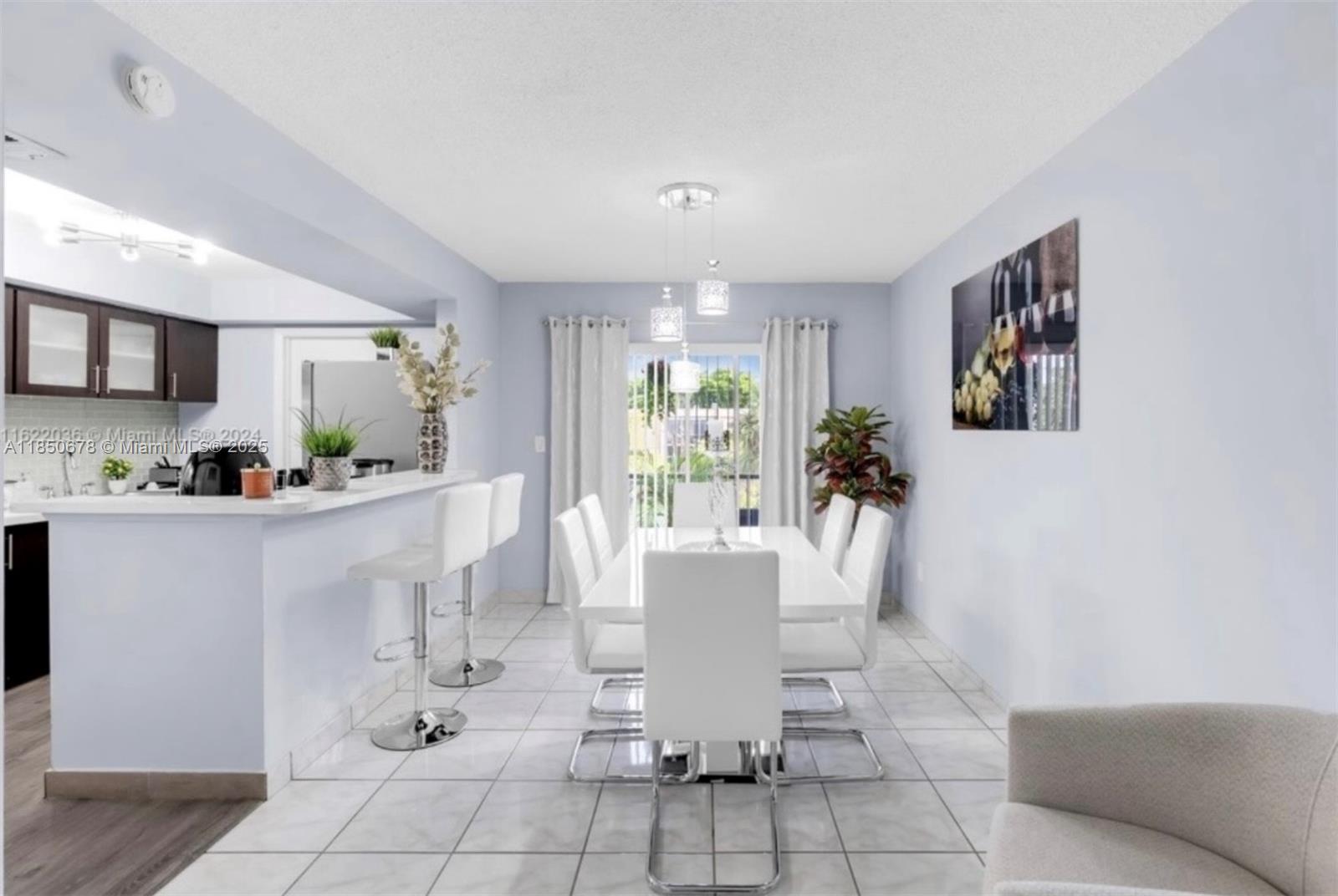8401 Southwest 107th Avenue, Unit 311E Miami, FL 33173 - Photo 2 of 9 a view of kitchen with furniture and large window