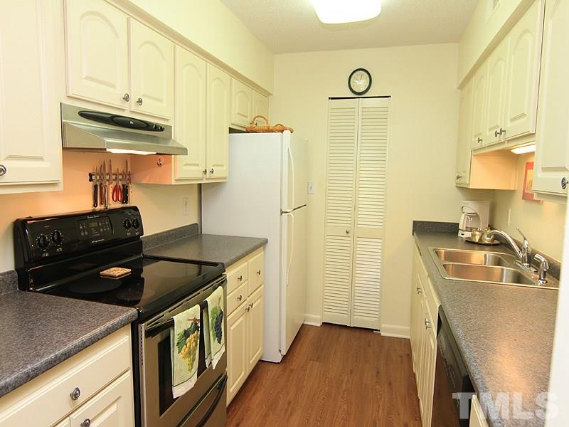 4709 Edwards Mill Road, Unit D Raleigh, NC 27612 - Photo 6 of 18 Small walk-in pantry at the end of the room.