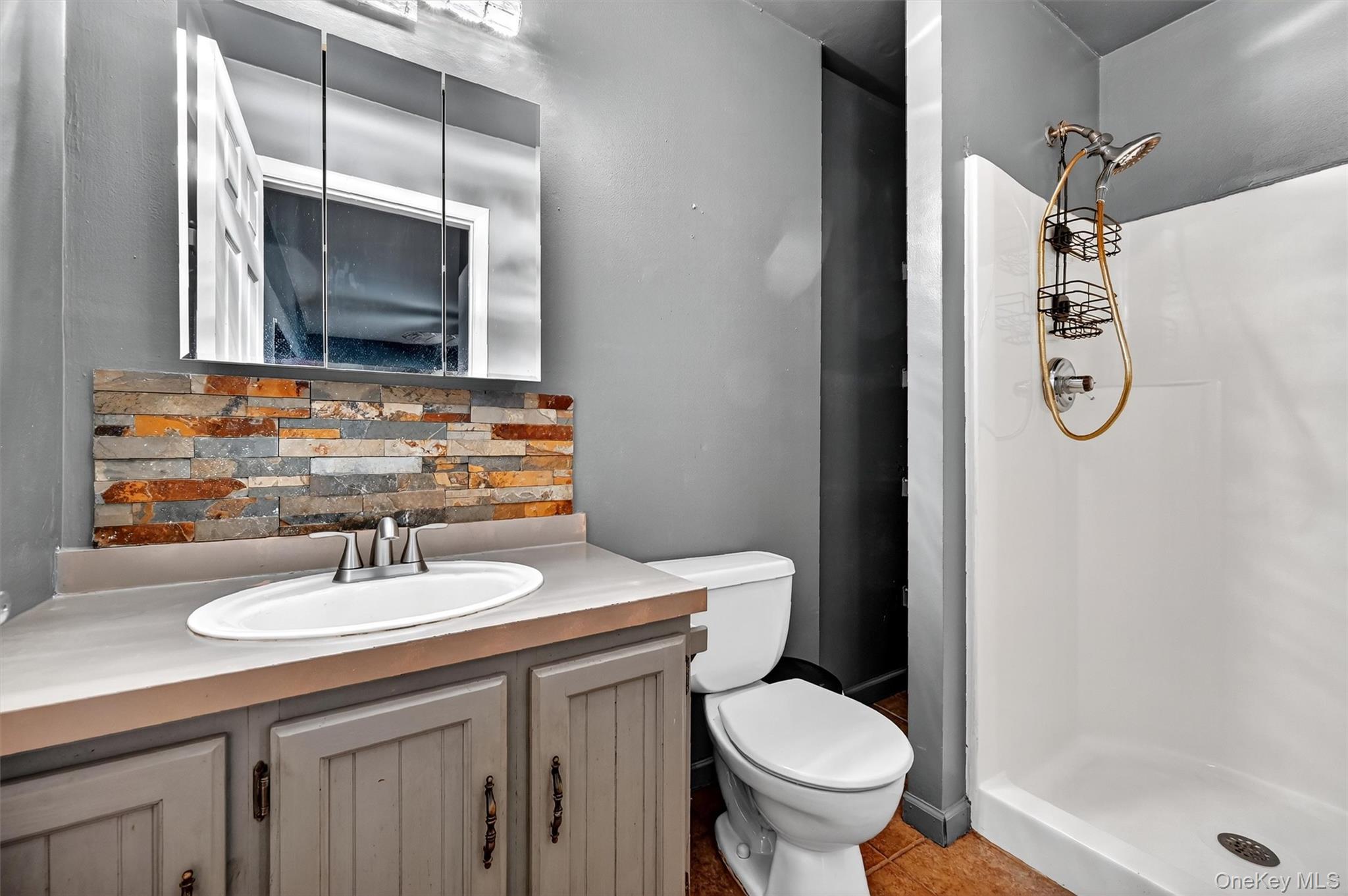 58 Shinhollow Road Port Jervis, NY 12771 - Photo 13 of 38 a bathroom with a toilet sink and mirror