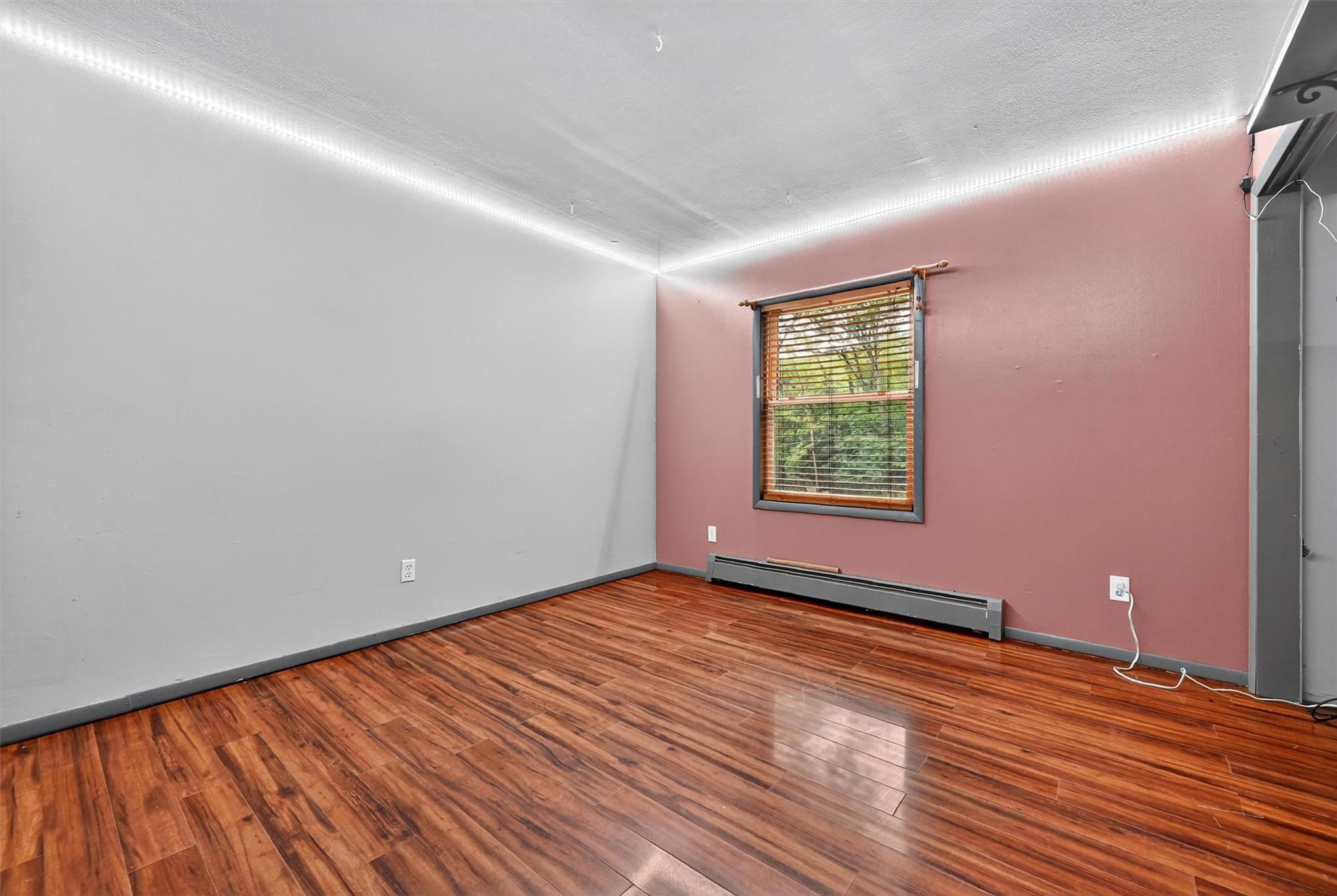 58 Shinhollow Road Port Jervis, NY 12771 - Photo 14 of 38 a view of an empty room with wooden floor and a window