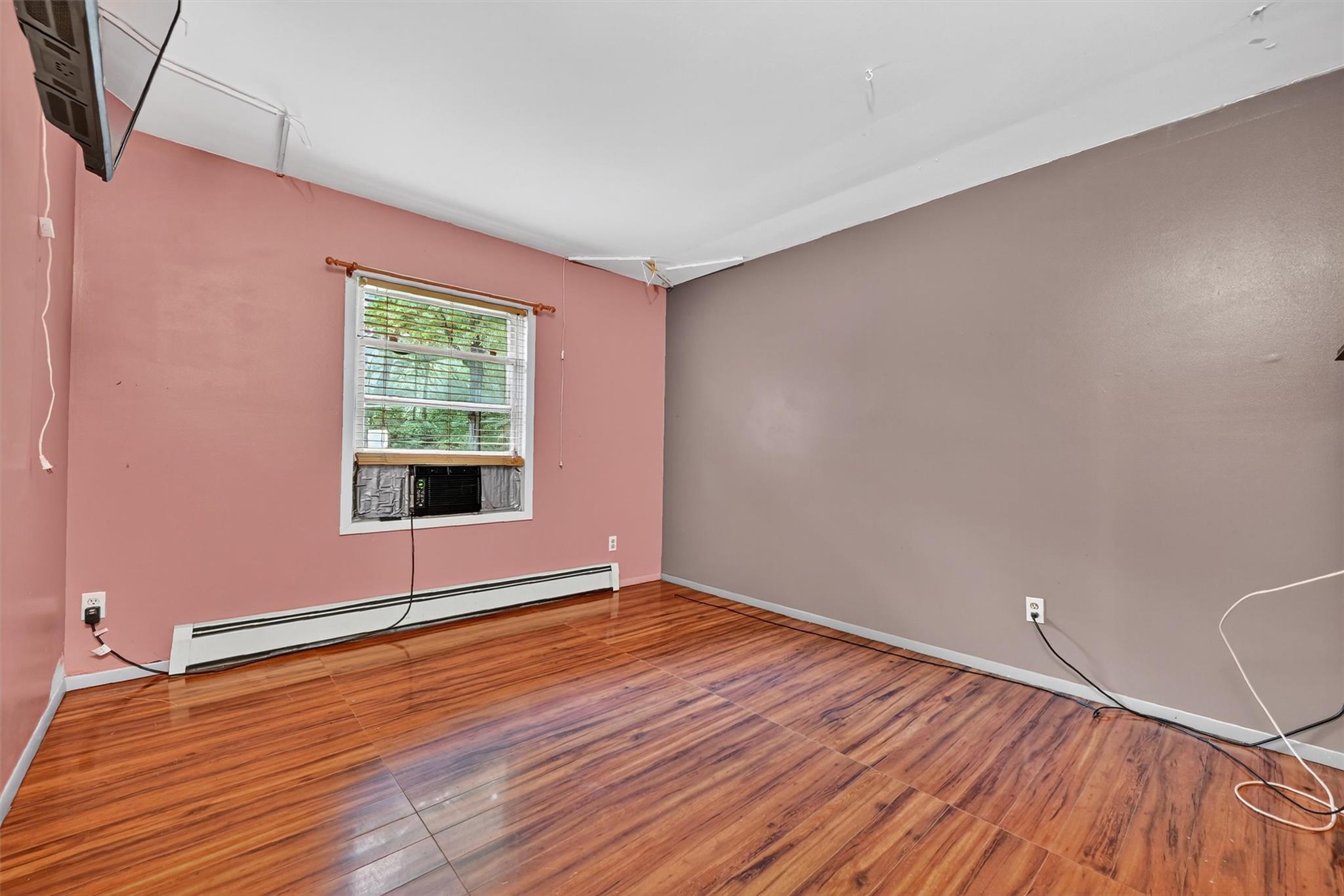 58 Shinhollow Road Port Jervis, NY 12771 - Photo 16 of 38 a view of an empty room with wooden floor and a window