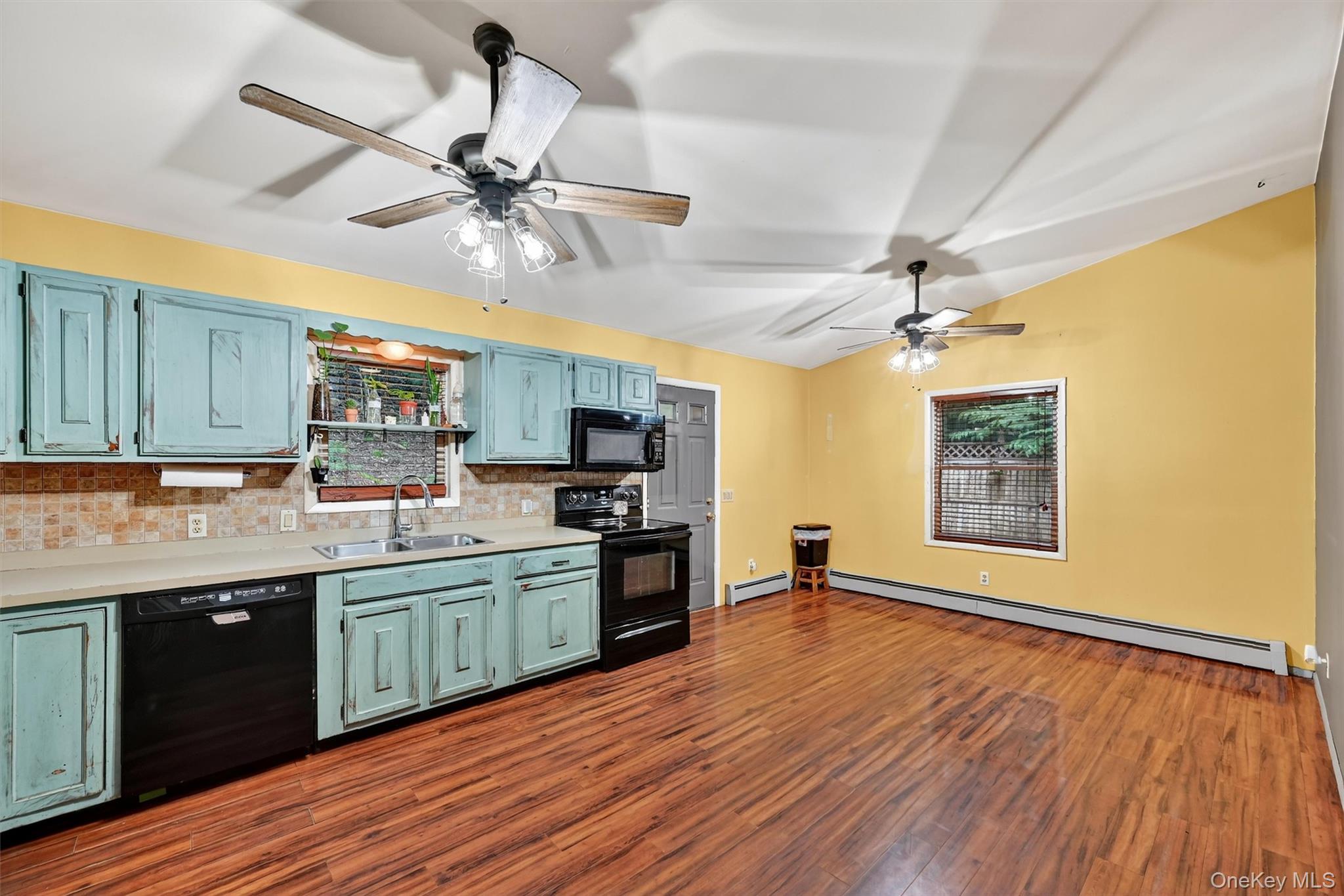58 Shinhollow Road Port Jervis, NY 12771 - Photo 3 of 38 a kitchen with stainless steel appliances granite countertop a sink cabinets and wooden floor