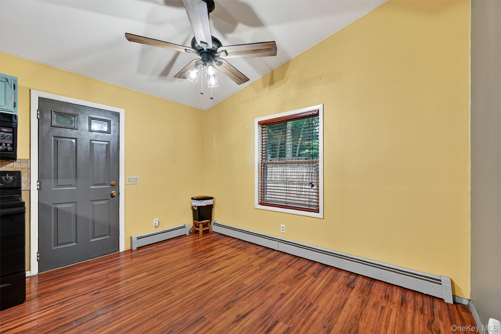58 Shinhollow Road Port Jervis, NY 12771 - Photo 8 of 38 a view of an empty room with wooden floor and a window