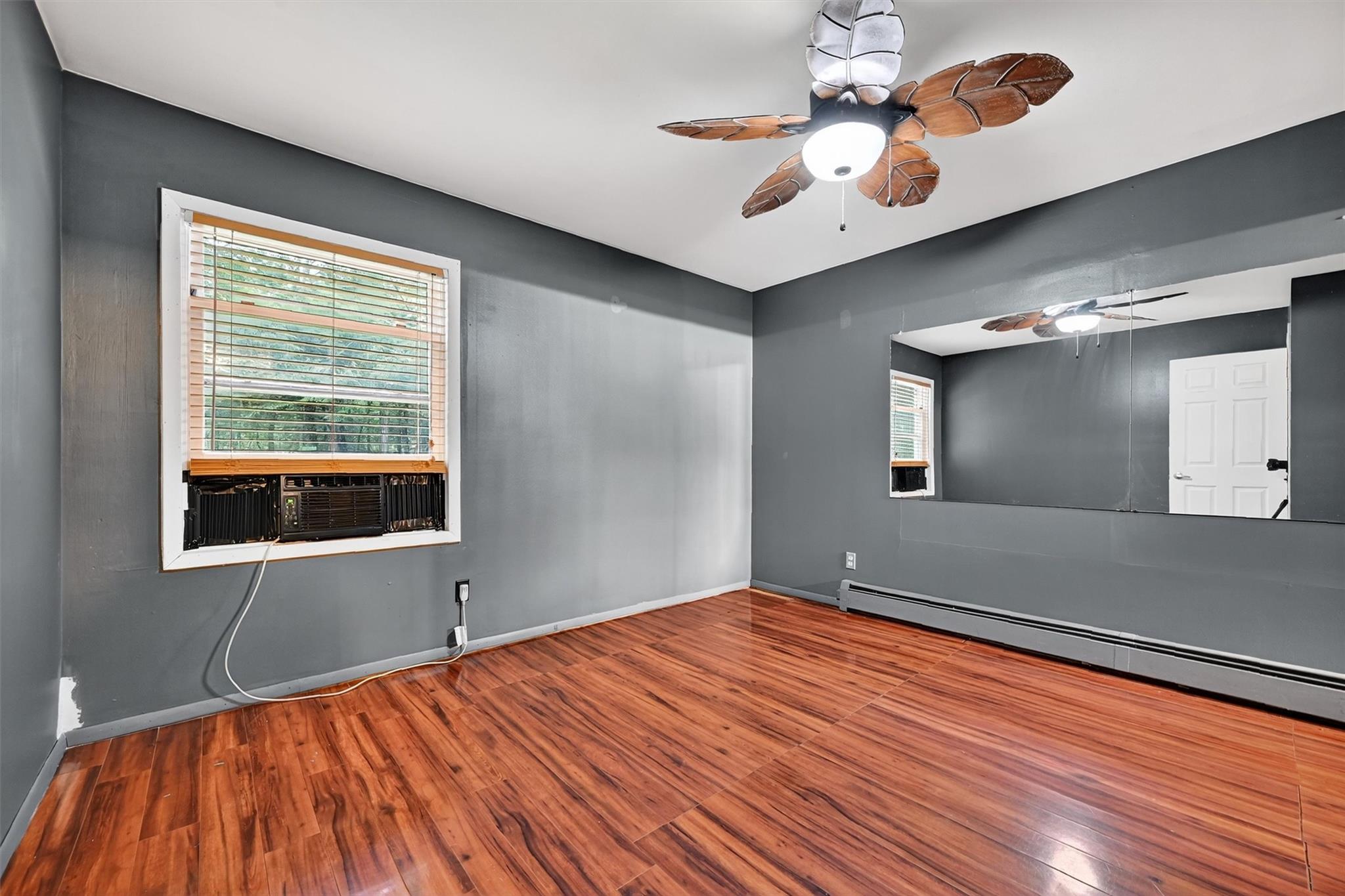 58 Shinhollow Road Port Jervis, NY 12771 - Photo 9 of 38 a bedroom with a bed and a chandelier