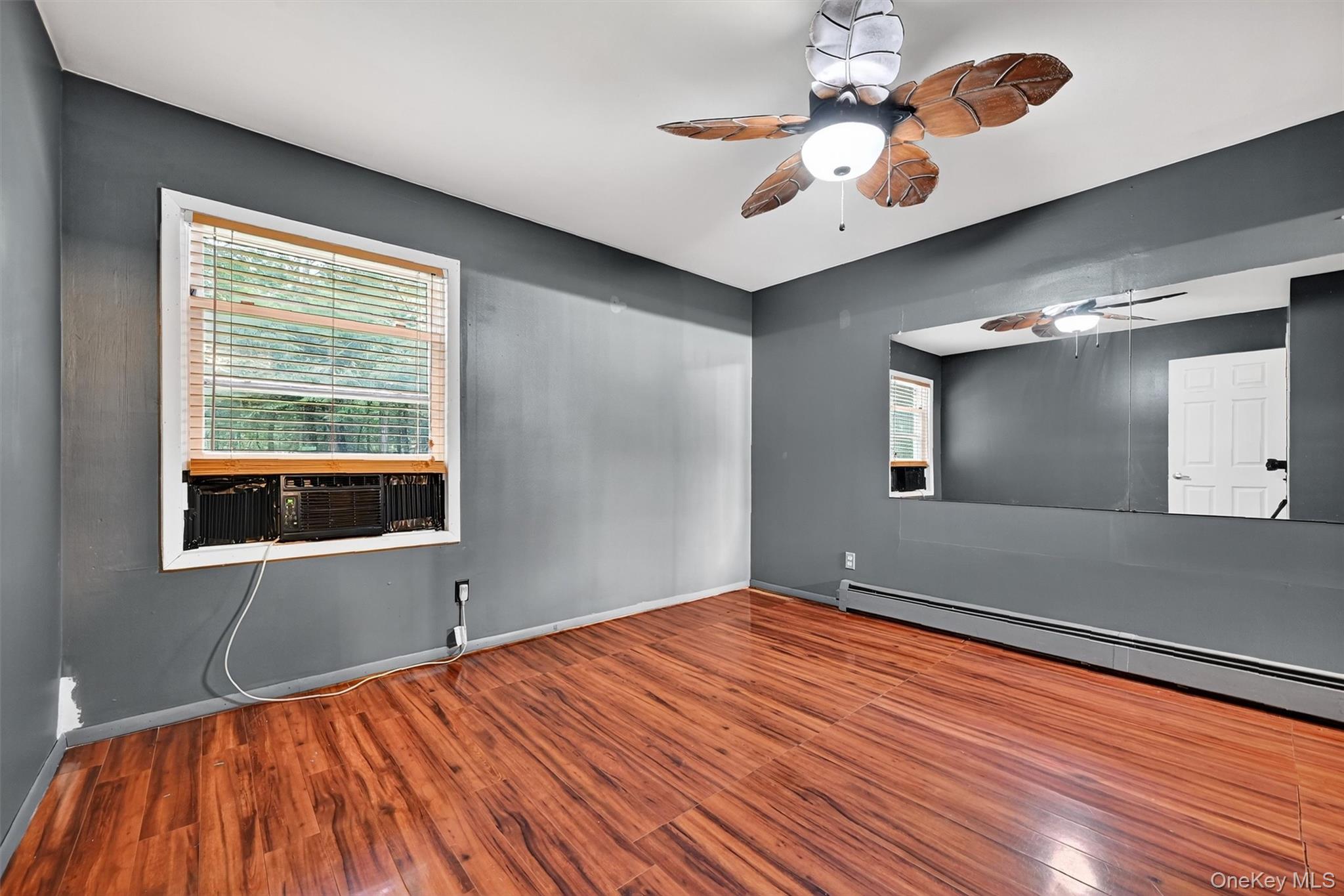 58 Shinhollow Road Port Jervis, NY 12771 - Photo 9 of 38 a bedroom with a bed and a chandelier