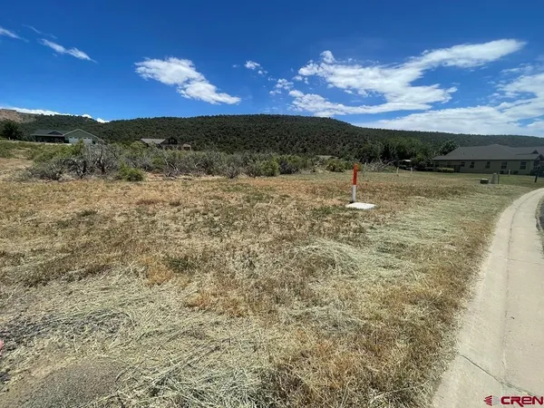 a view of a lake in the sunset