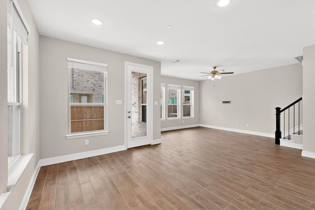 900 Heart Reef Road Plano, TX 75075 - Photo 15 of 40 wooden floor in an empty room with a window