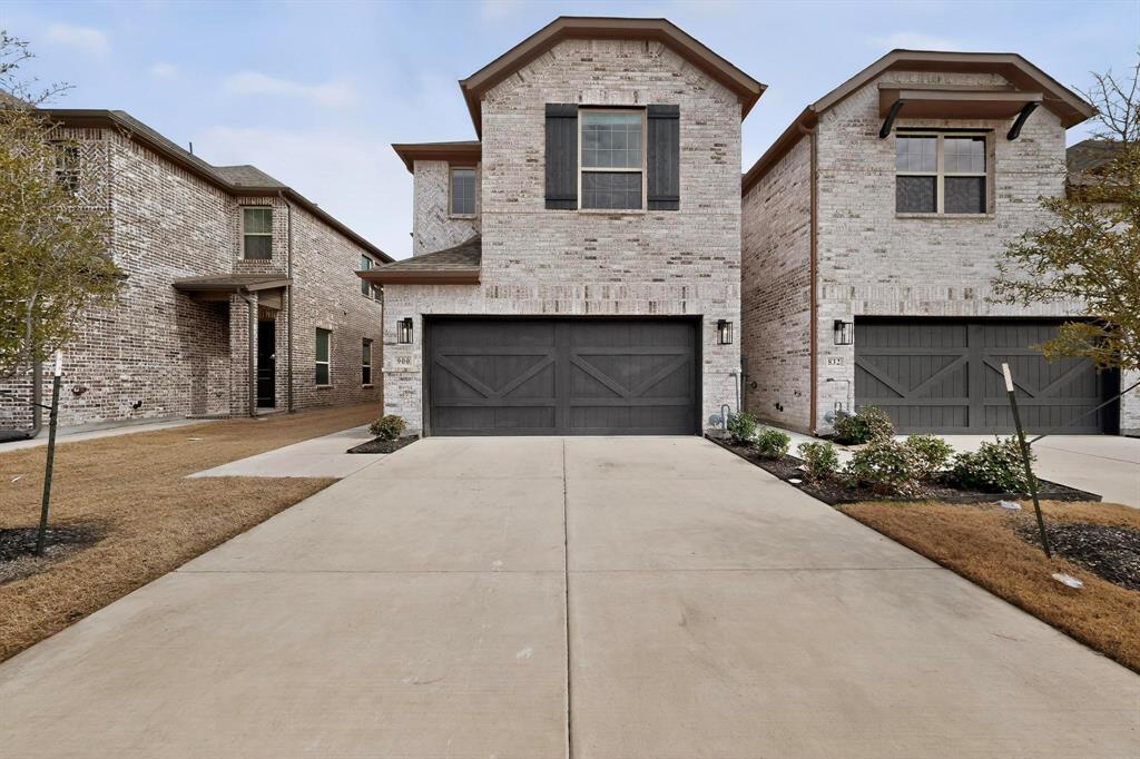 900 Heart Reef Road Plano, TX 75075 - Photo 2 of 40 a front view of a house with a yard and garage