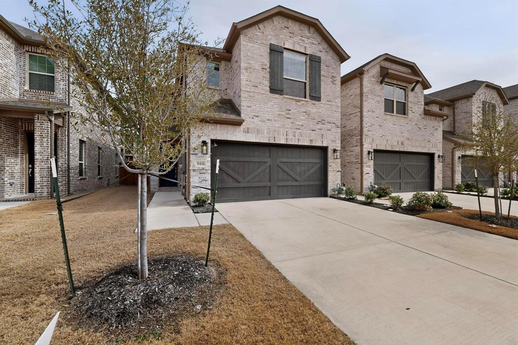 900 Heart Reef Road Plano, TX 75075 - Photo 3 of 40 a front view of a house with a yard