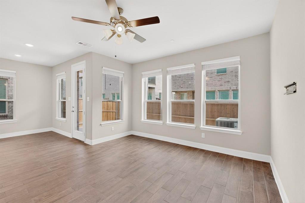 900 Heart Reef Road Plano, TX 75075 - Photo 8 of 40 a view of an empty room with a window and wooden floor