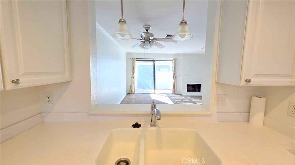 8708 1/2 Pine Crest Place Rancho Cucamonga, CA 91730 - Photo 8 of 22 a view of a kitchen with a sink