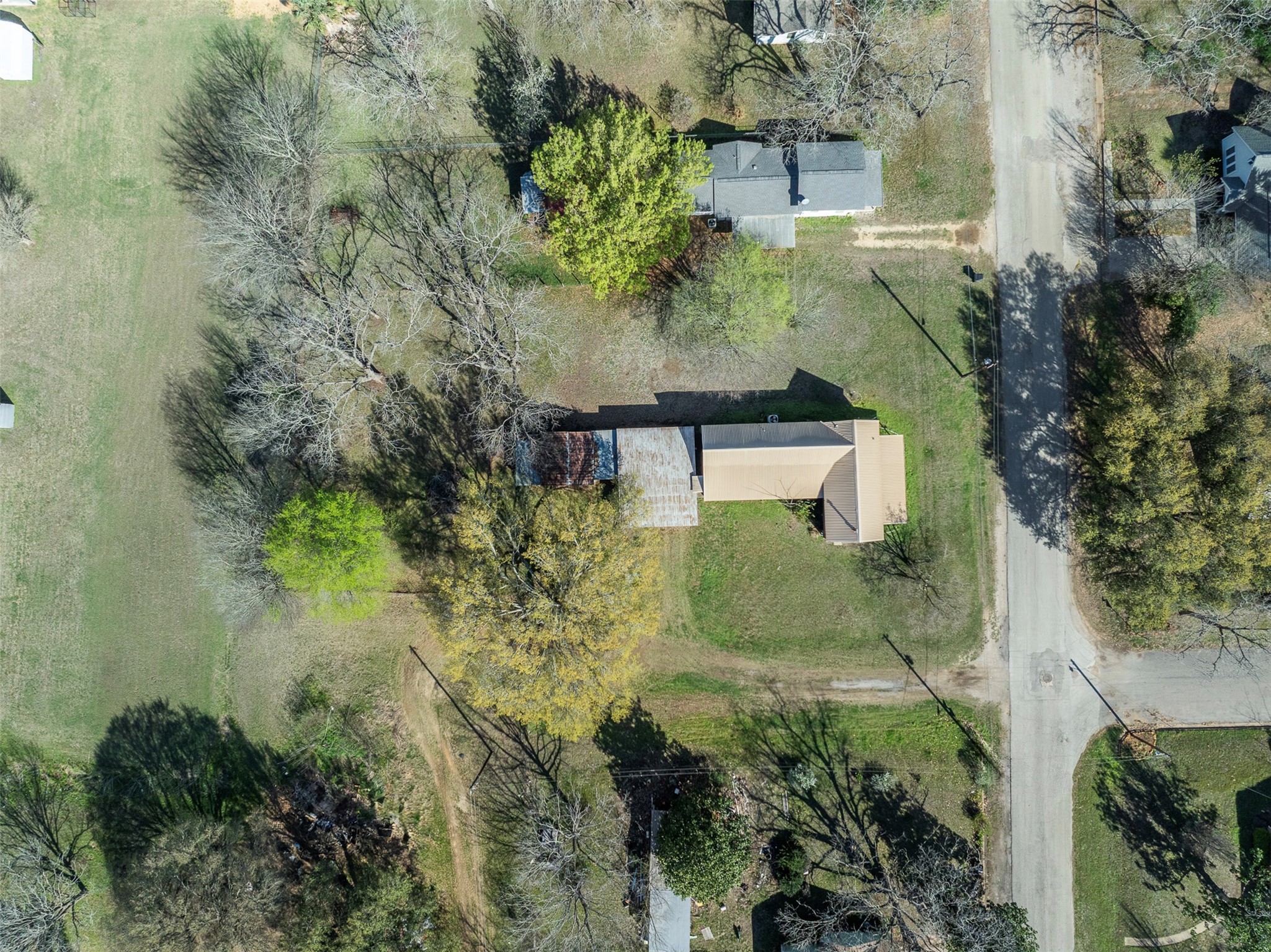 809 Main Street Lexington, TX 78947 - Photo 7 of 23 an aerial view of a house with a yard