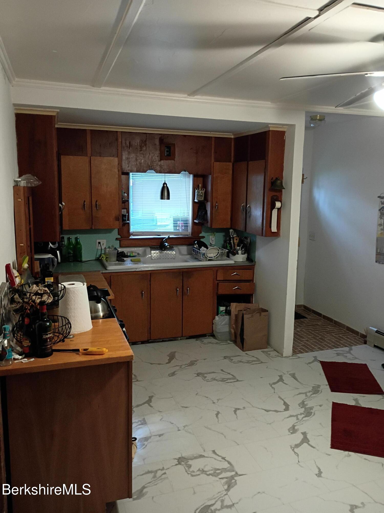 24 Franklin Street North Adams, MA 01247 - Photo 19 of 43 a kitchen with stainless steel appliances a sink stove and refrigerator