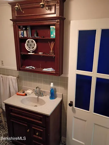 a bathroom with a bathtub and shower