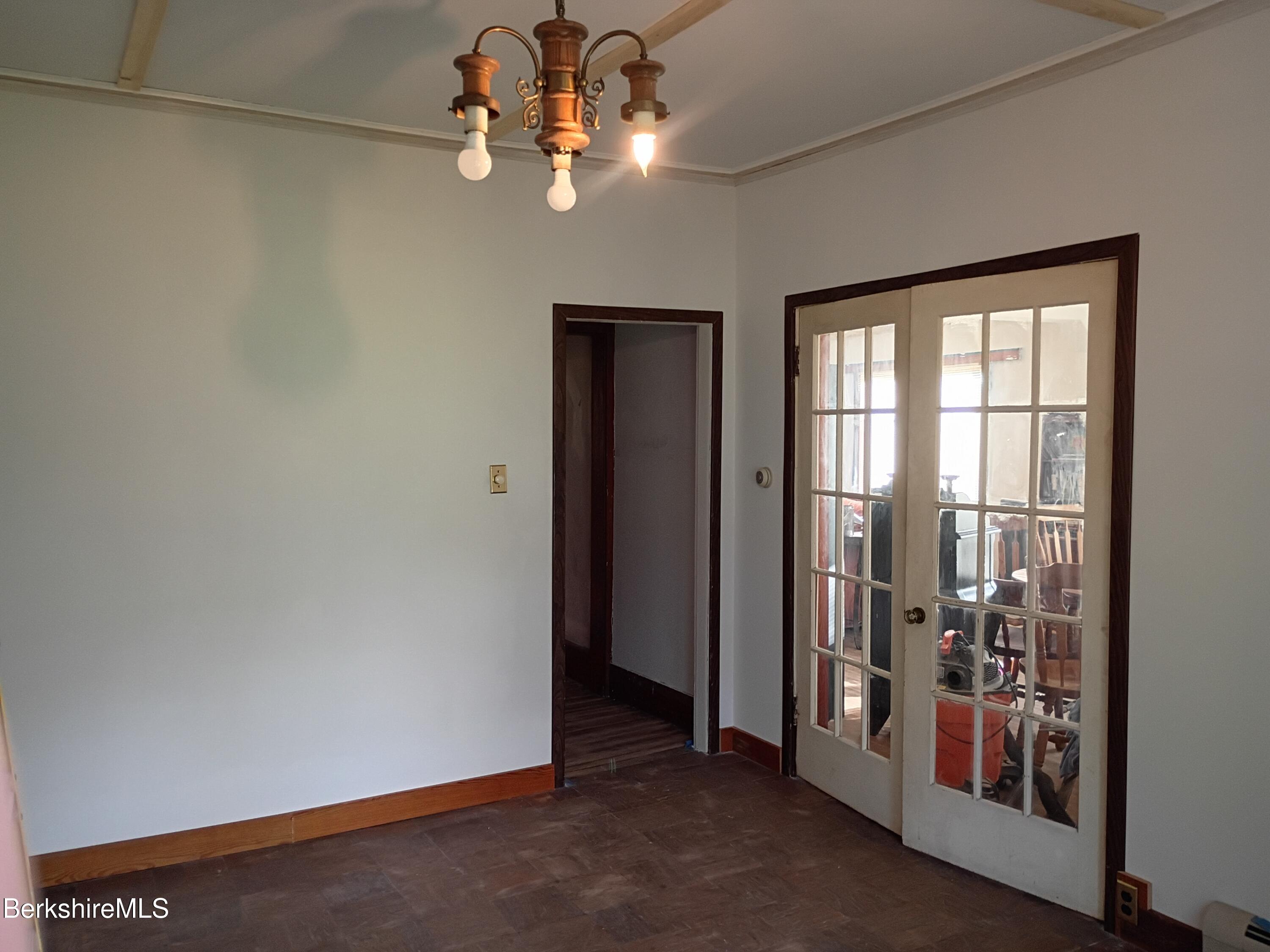 24 Franklin Street North Adams, MA 01247 - Photo 28 of 45 an empty room with windows and entrance