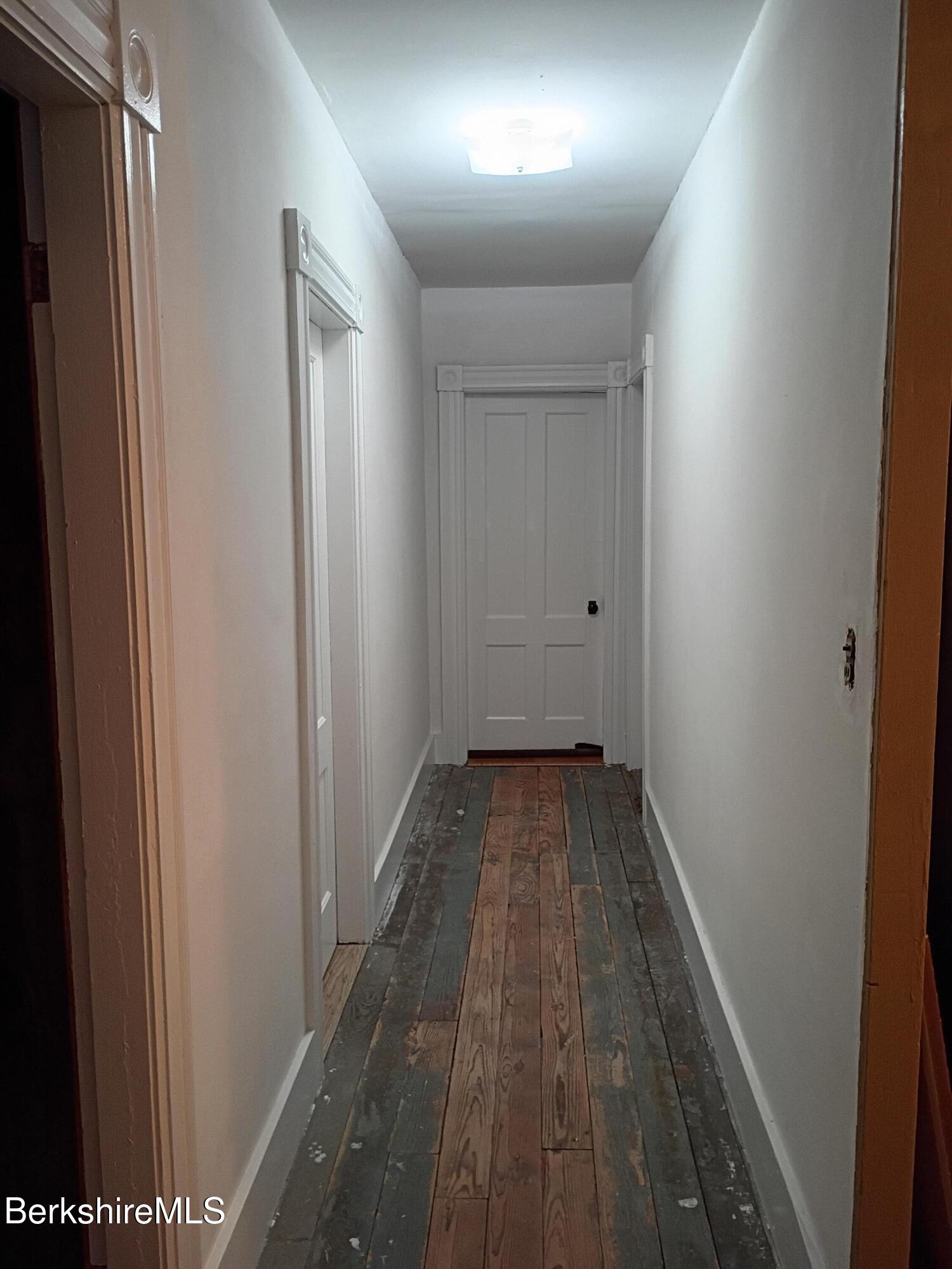 24 Franklin Street North Adams, MA 01247 - Photo 38 of 45 a view of a hallway with wooden floor