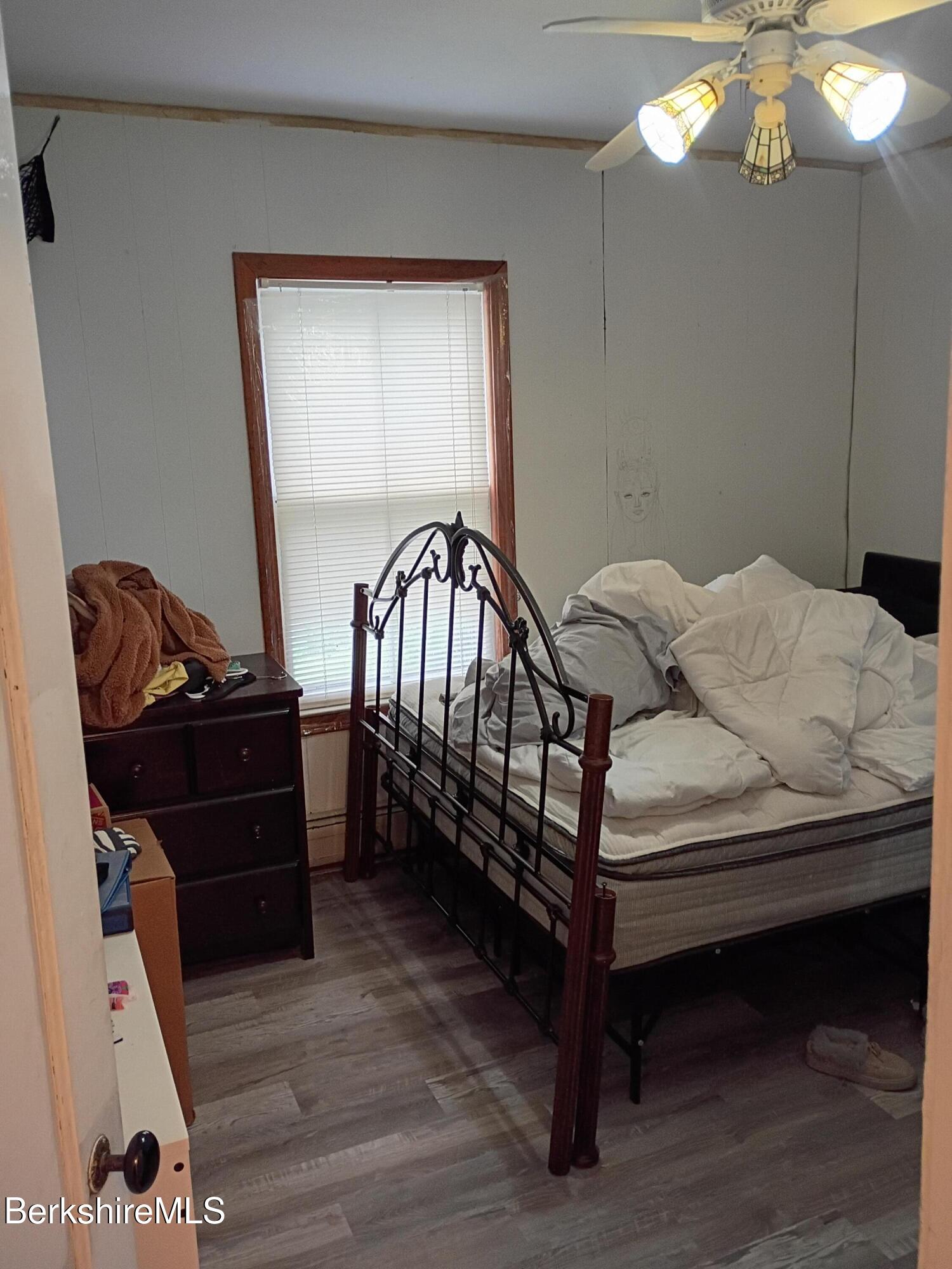 24 Franklin Street North Adams, MA 01247 - Photo 40 of 43 a bedroom with a bed and wooden floor