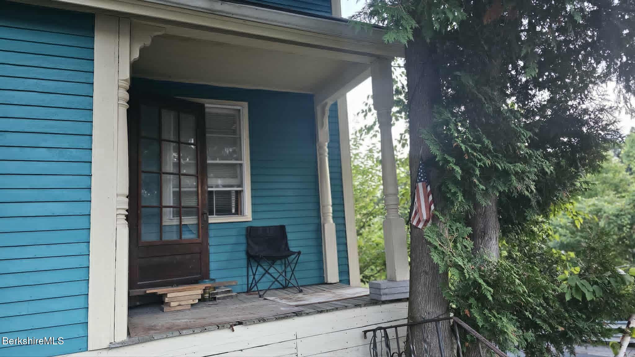 24 Franklin Street North Adams, MA 01247 - Photo 5 of 43 a view of backyard with chair and potted plants