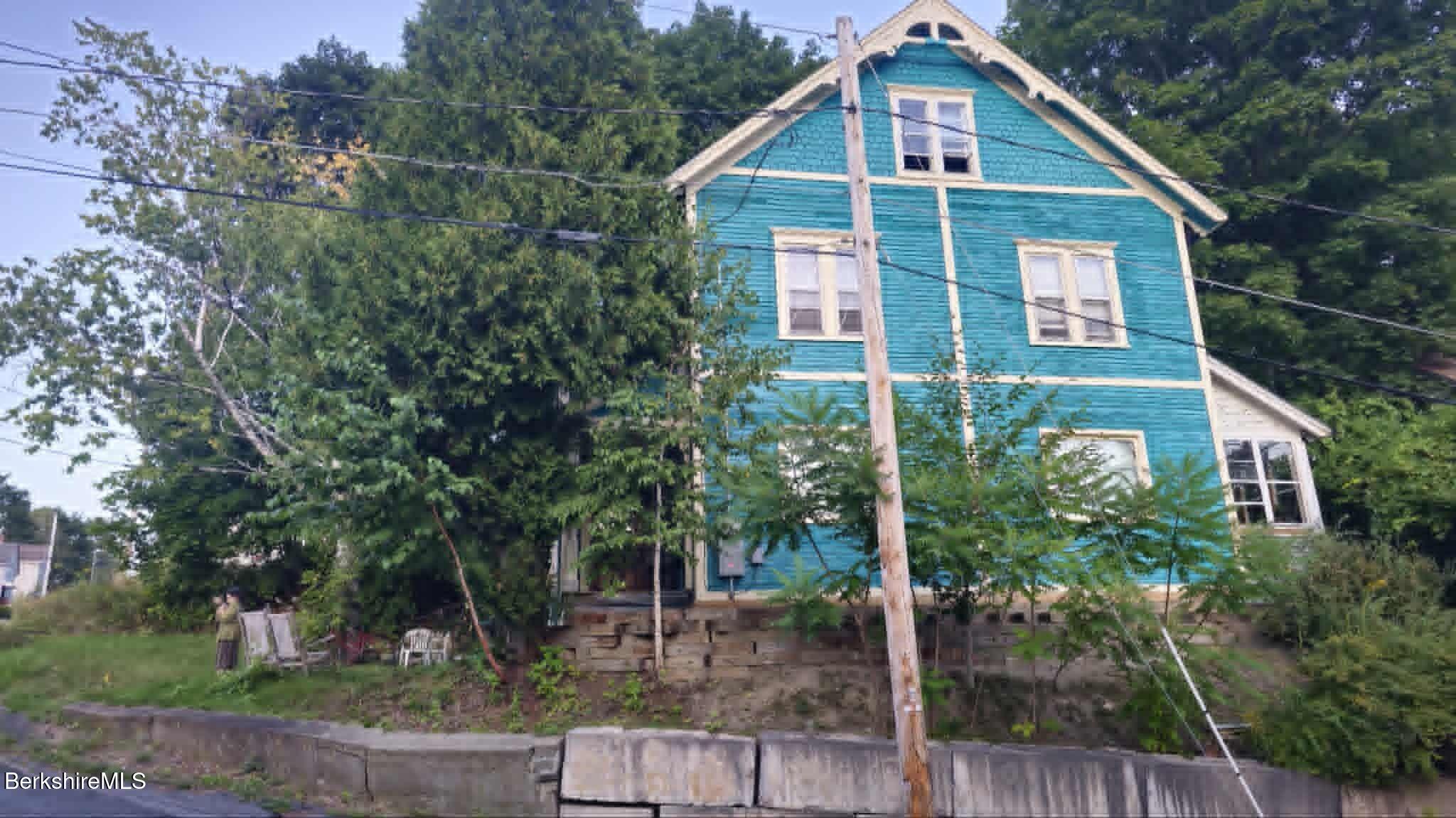 24 Franklin Street North Adams, MA 01247 - Photo 10 of 45 a view of a house with yard and trees