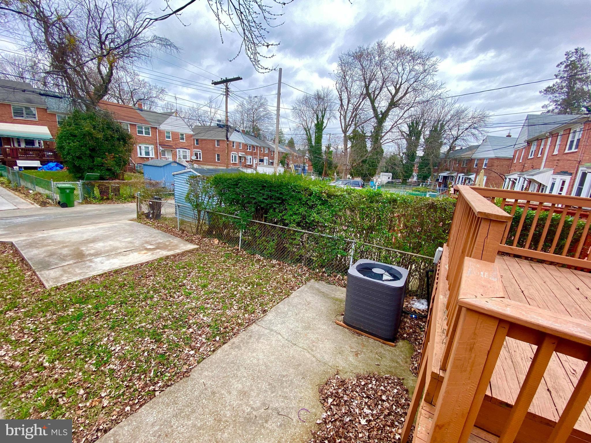 1604 Pentwood Road Baltimore, MD 21239 - Photo 13 of 19 a backyard of a house with barbeque oven fire pit table and chairs