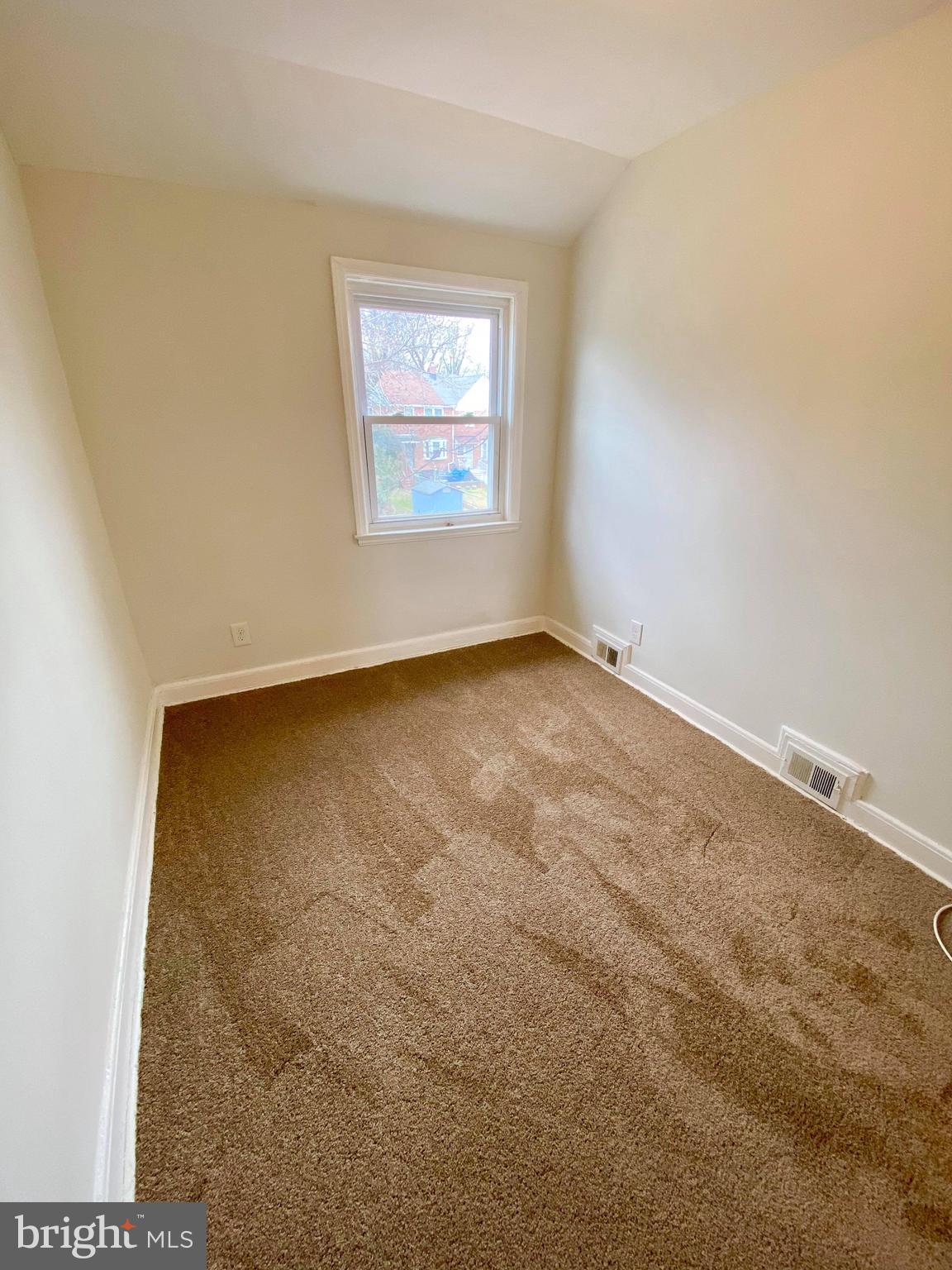 1604 Pentwood Road Baltimore, MD 21239 - Photo 15 of 19 an empty room with a window