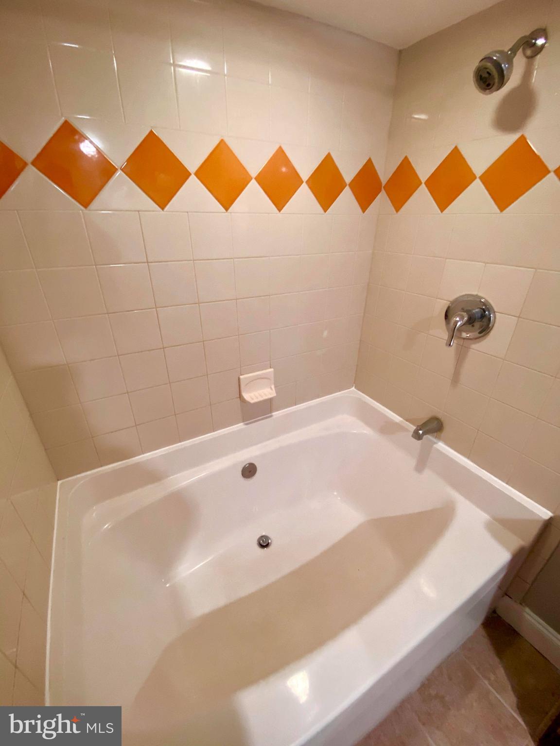 1604 Pentwood Road Baltimore, MD 21239 - Photo 17 of 19 a bathroom with a sink and a bathtub