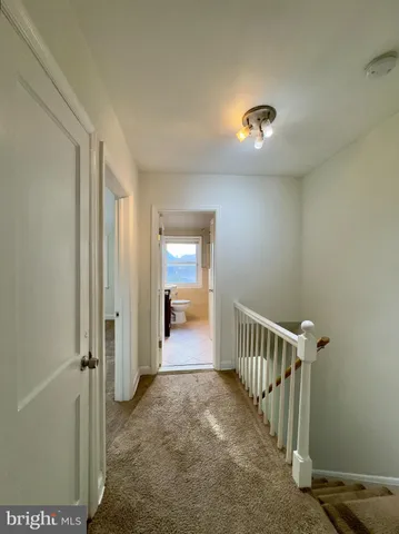 a view of a hallway with a livingroom