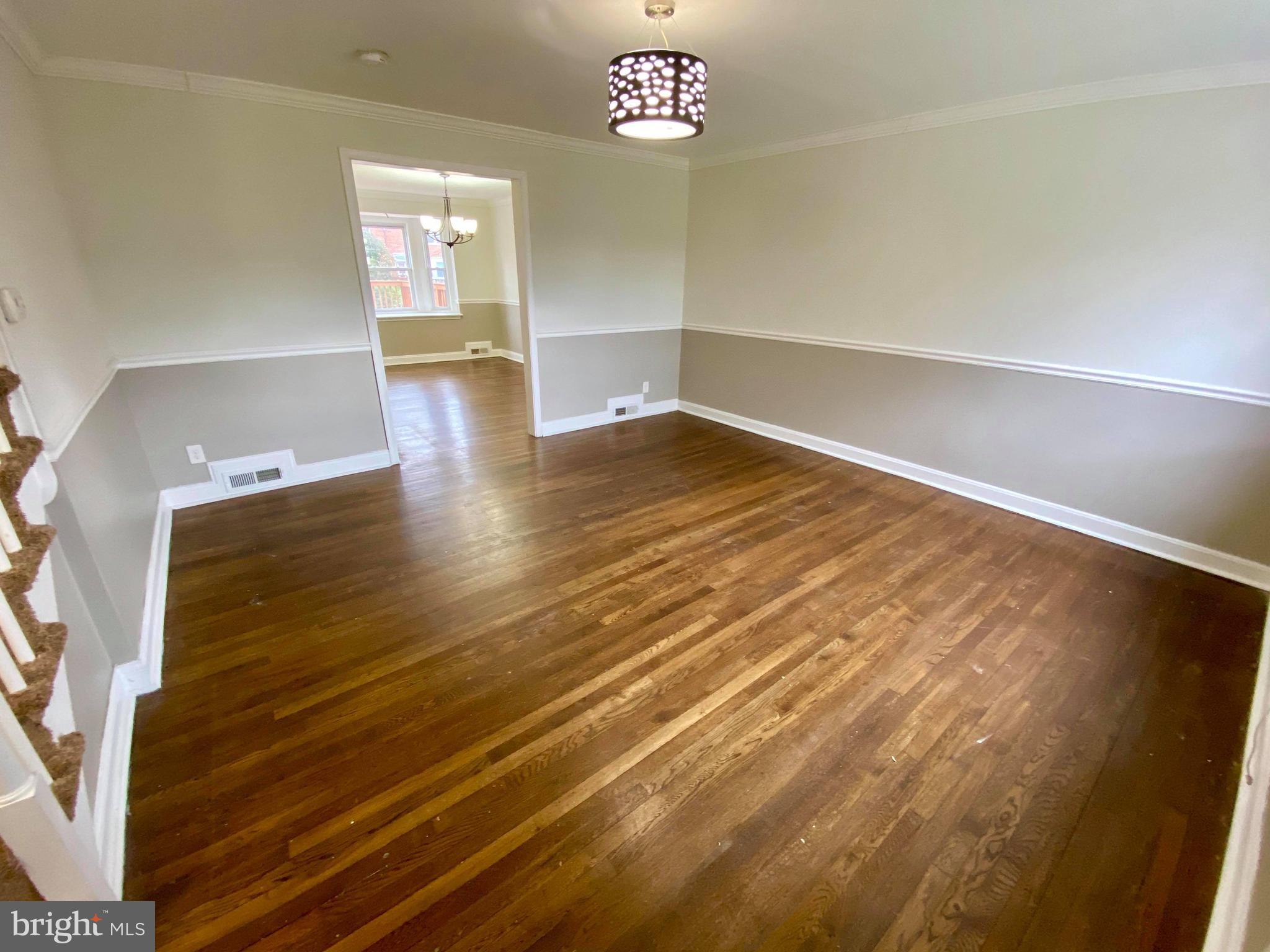 1604 Pentwood Road Baltimore, MD 21239 - Photo 7 of 19 a view of empty room with wooden floor