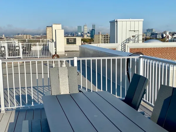 a view of a balcony with wooden floor