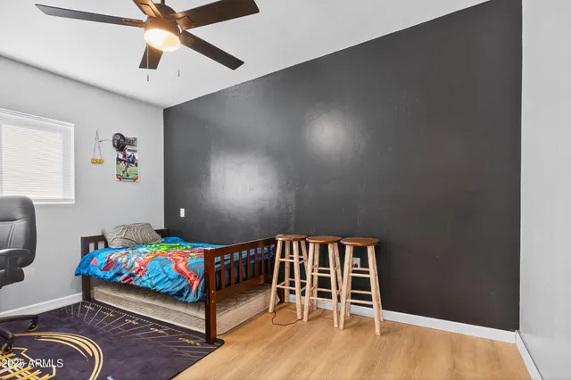 a bedroom with a bed and a dresser