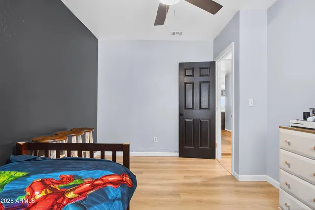 a bedroom with a bed and dresser