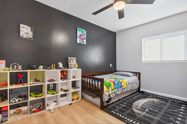 a bedroom with furniture and a book shelf