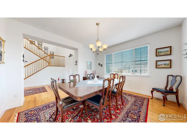 a living room with a bed furniture and a window