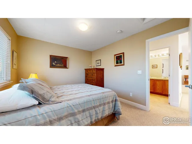 a living room with a bed furniture and a window
