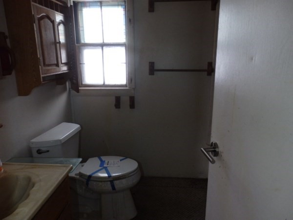 26 Alder Road Norton, MA 02766 - Photo 12 of 16 a bathroom with a toilet and a window