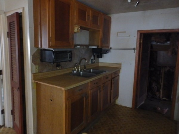 26 Alder Road Norton, MA 02766 - Photo 9 of 16 a kitchen with a sink cabinets and appliances
