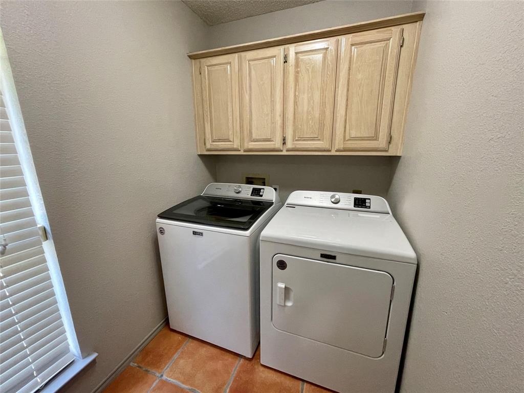 8701 Bellechase Road Granbury, TX 76049 - Photo 12 of 15 a utility room with dryer and washer