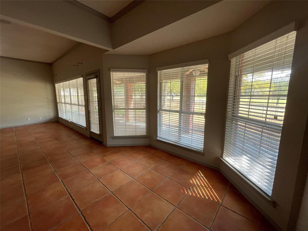 8701 Bellechase Road Granbury, TX 76049 - Photo 4 of 15 a view of a room with large windows