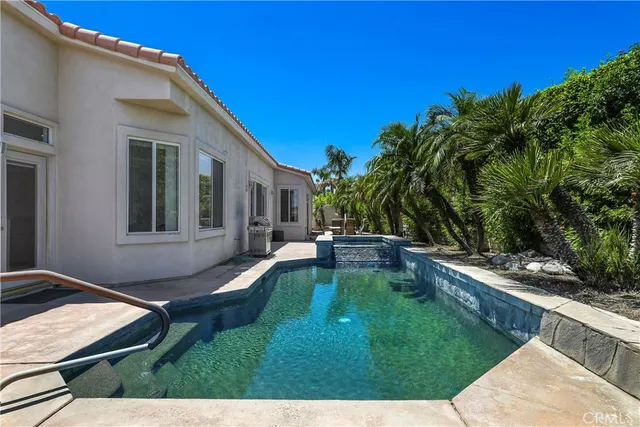 a view of an house with backyard porch and patio