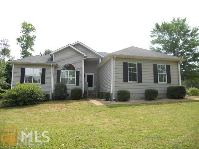 130 Aristocratic Way Locust Grove, GA 30248 - Photo 1 of 1 a front view of a house with a garden